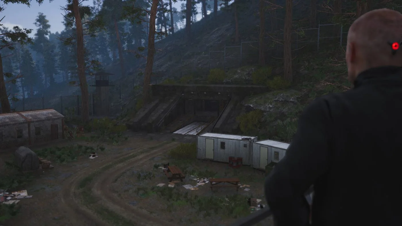 SCUM prisoner overlooking a forest bunker compound on the island